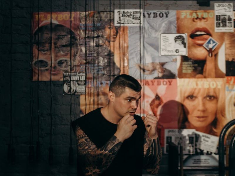 Person focused on movement in a minimalist gym setting.